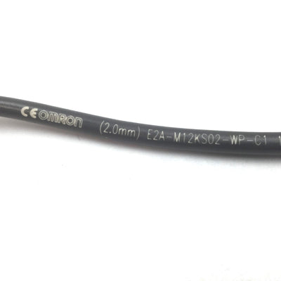 Used Omron E2A-M12KS02-WP-C1 Proximity Sensor, Range: 2mm, 12-24VDC, NPN N/O, M12